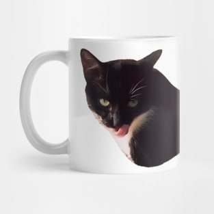 Suspicious licking black and white cat Mug